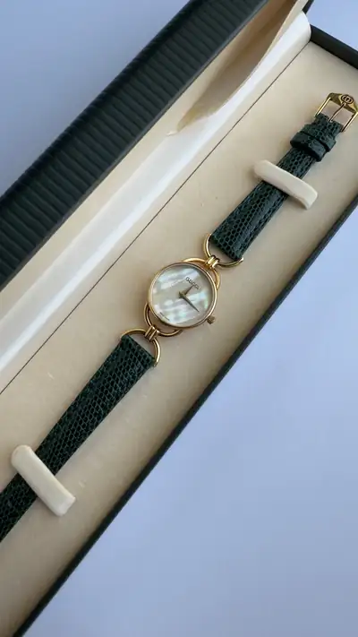 Gucci Mother-of-Pearl Round Watch with Green Strap 1