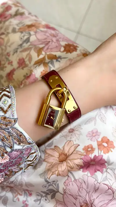 Hermès Kelly Gold-Tone Padlock Watch 8